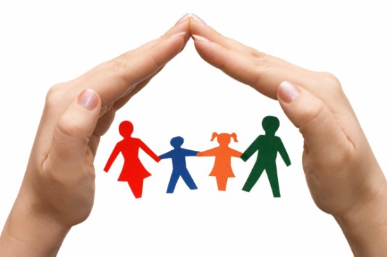 Paper cutout of family holding hands